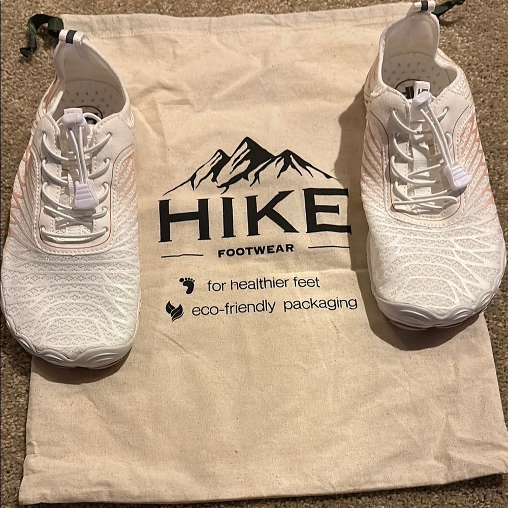 Hike barefoot shoes.  Size 39 EU.  8.0/8.5 US.  White and pink.  Brand new.